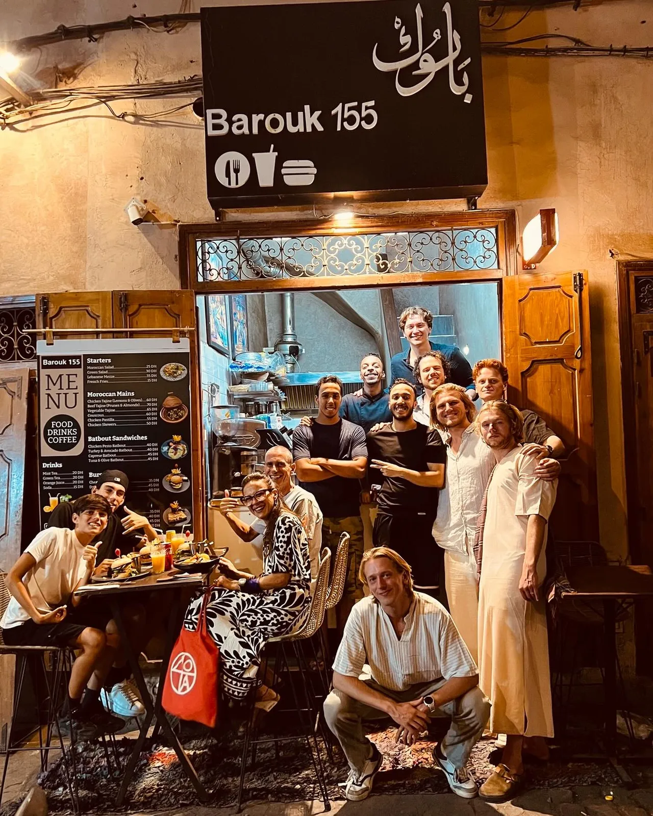 Barouk 155 storefront lit up at night in the medina